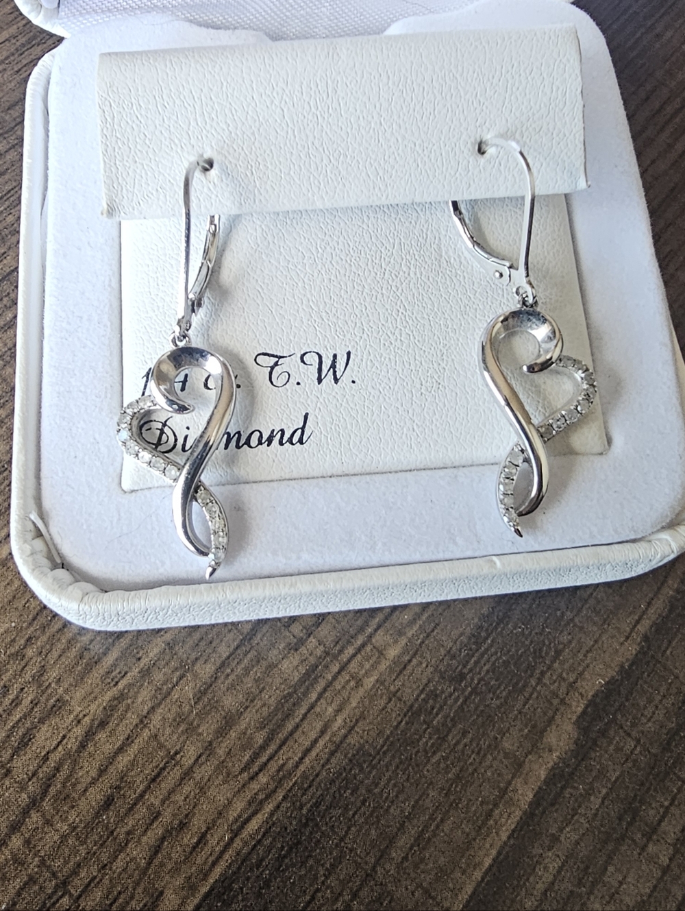 1/4 CT Diamond Infinity Heart Earings. Silver w/stud clasp closure